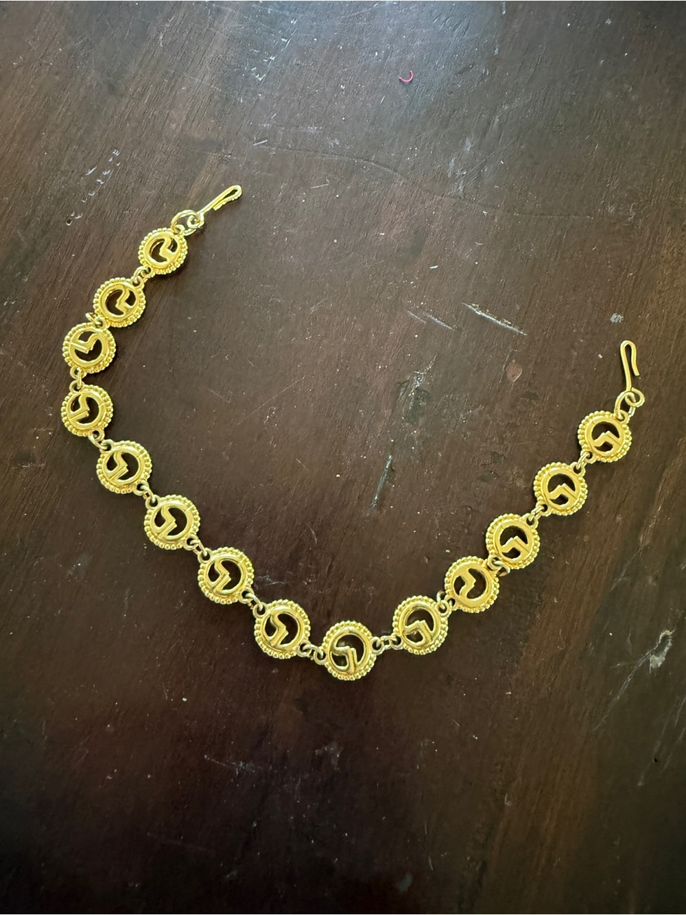 Vintage St. John gold tone sweater accent?